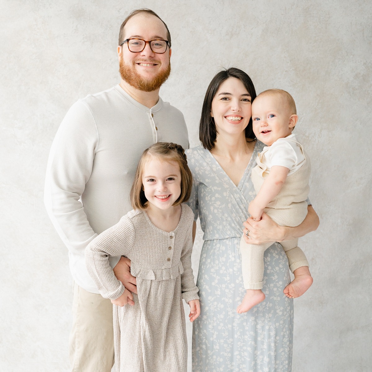 Studio portrait of a family with two children.